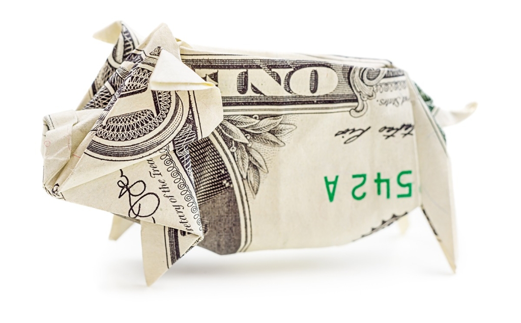 Dollar origami pig isolated on white background. Moneygami. Piggy bank.